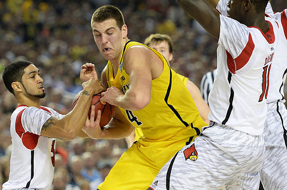 Mitch McGary (4) and Spike Albrecht (2)