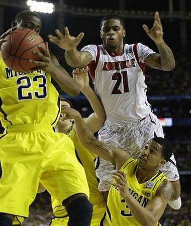 Caris LeVert (23) and Trey Burke (3)