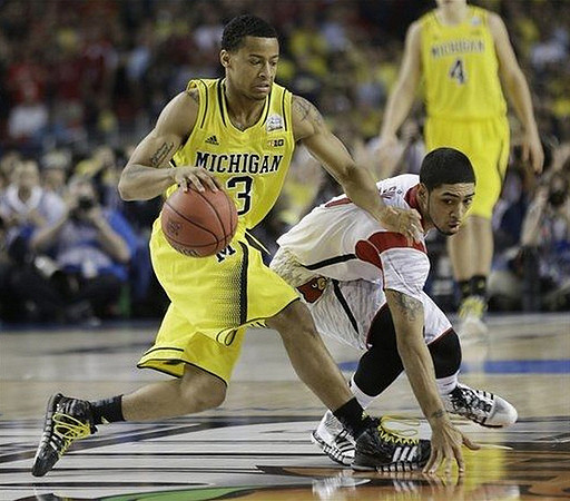 Trey Burke (3) and Mitch McGary (4)