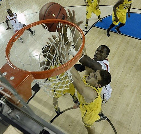 Mitch McGary (4), Glenn Robinson III (1), Trey Burke (3), and Tim Hardaway Jr. (10)