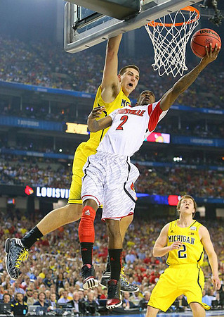 Mitch McGary (4) and Spike Albrecht (2)