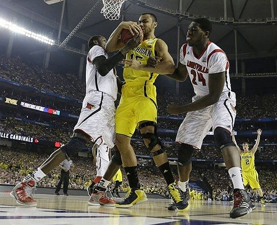 Jon Horford (15) and Spike Albrecht (2)