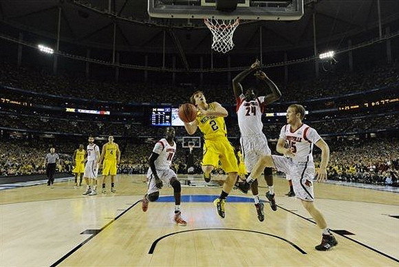 Glenn Robinson III (1), Mitch McGary (4), and Spike Albrecht (2)