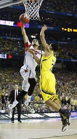 Trey Burke (3) and Louisville Head Coach Rick Pitino