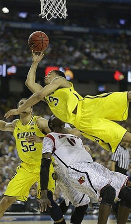 Jordan Morgan (52) and Trey Burke (3)