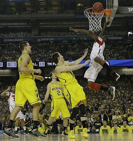 Mitch McGary (4), Spike Albrecht (2), and Nik Stauskas (11)