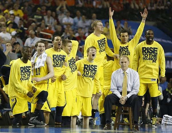 Caris LeVert (23), Nik Stauskas (11), Jordan Morgan (52), Max Bielfeldt (44), Matt Vogrich (13), Blake McLimans (22), Josh Bartelstein (20), Corey Person (32), and John Beilein