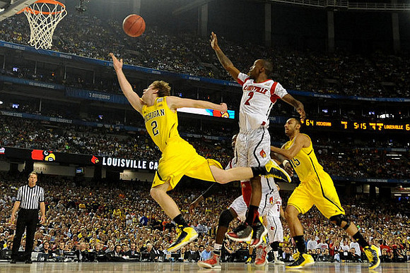 Spike Albrecht (2) and Jon Horford (15)