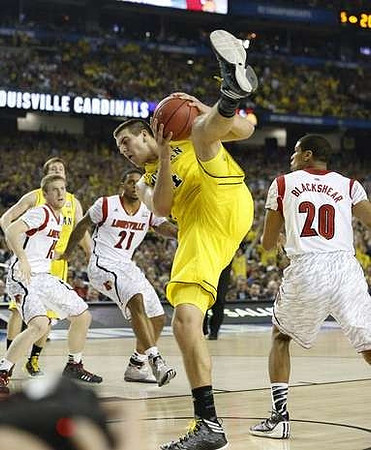Mitch McGary (4) and Spike Albrecht (2)