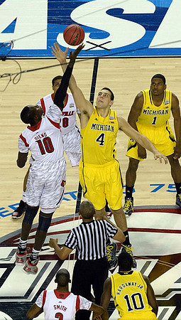Mitch McGary (4), Glenn Robinson III (1), and Tim Hardaway Jr. (10)