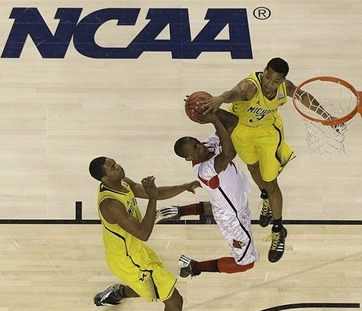 Glenn Robinson III (1) and Trey Burke (3)