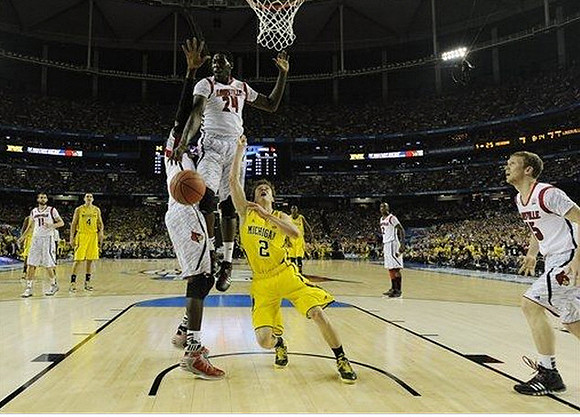 Mitch McGary (4) and Spike Albrecht (2)