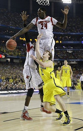 Spike Albrecht (2), Mitch McGary (4), and Glenn Robinson III (1)