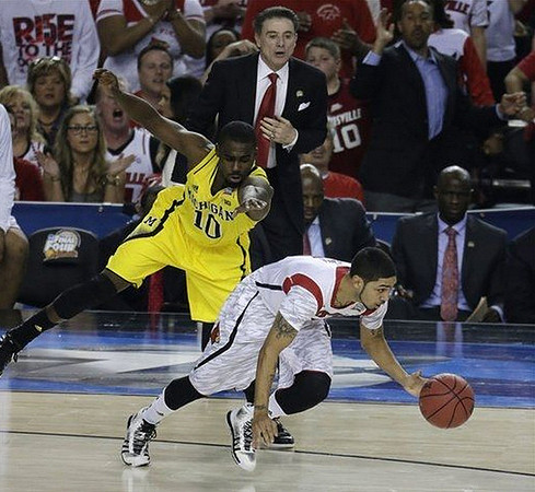 Tim Hardaway Jr. (10) and Louisville Head Coach Rick Pitino