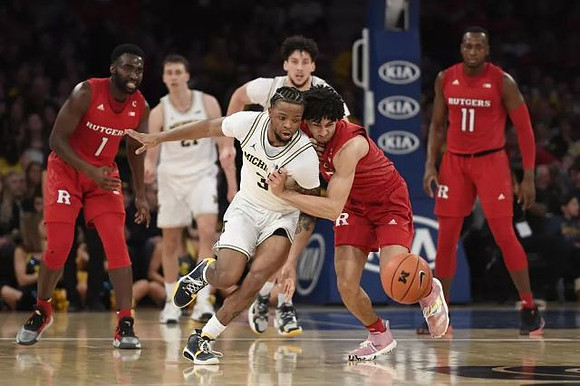 Zavier Simpson (3), Franz Wagner (21), and Brandon Johns Jr. (23)