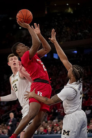 Jon Teske (15) and Zavier Simpson (3)