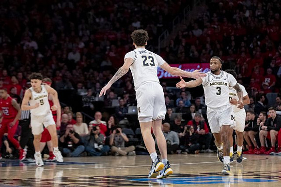 Adrien Nunez (5), Brandon Johns Jr. (23), Zavier Simpson (3), and David DeJulius (0)