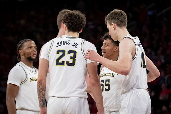 Zavier Simpson (3), Jon Teske (15), Brandon Johns Jr. (23), Eli Brooks (55), and Franz Wagner (21)