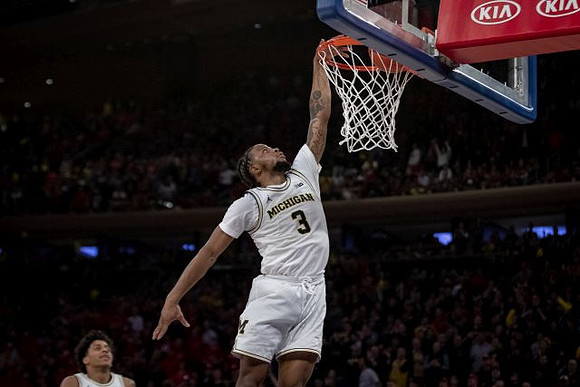 Zavier Simpson (3) and Eli Brooks (55)
