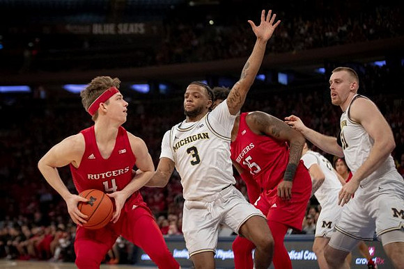 Zavier Simpson (3), Austin Davis (51), and Brandon Johns Jr. (23)