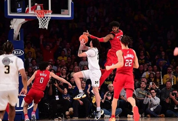 Zavier Simpson (3) and Brandon Johns Jr. (23)
