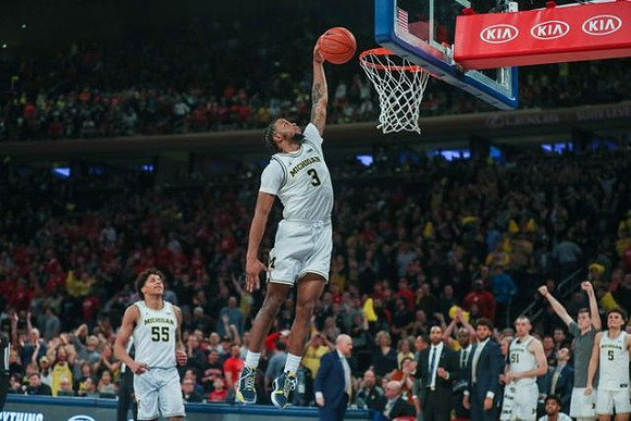 Eli Brooks (55) and Zavier Simpson (3)