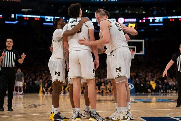 Zavier Simpson (3), Brandon Johns Jr. (23), and Austin Davis (51)