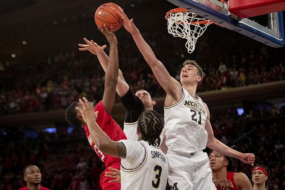 Zavier Simpson (3), Austin Davis (51), and Franz Wagner (21)