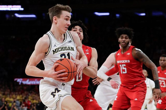 Franz Wagner (21), Jon Teske (15), and Zavier Simpson (3)