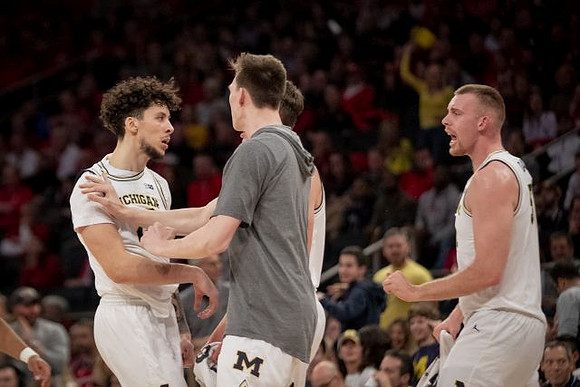 Brandon Johns Jr. (23), Colin Castleton (11), and Austin Davis (51)