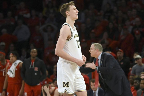 Franz Wagner (21) and Rutgers Head Coach Steve Pikiell