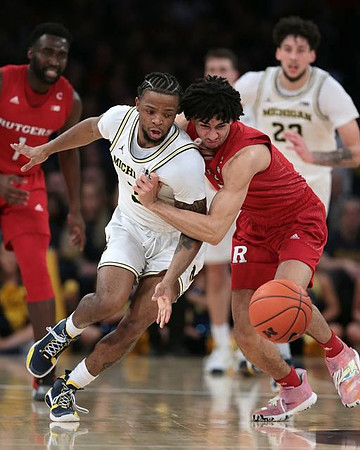 Zavier Simpson (3) and Brandon Johns Jr. (23)