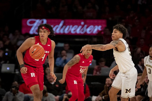 Eli Brooks (55) and Zavier Simpson (3)