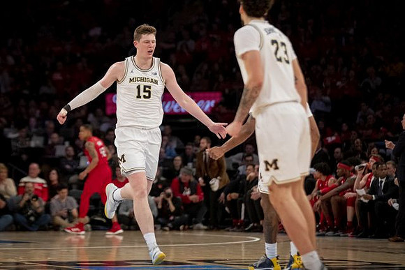 Jon Teske (15) and Brandon Johns Jr. (23)