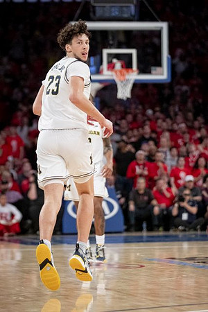 Brandon Johns Jr. (23) and Zavier Simpson (3)