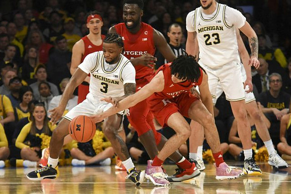 Zavier Simpson (3) and Brandon Johns Jr. (23)