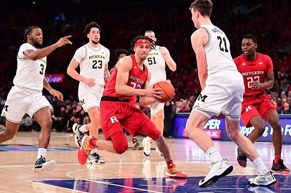 Zavier Simpson (3), Brandon Johns Jr. (23), Austin Davis (51), and Franz Wagner (21)
