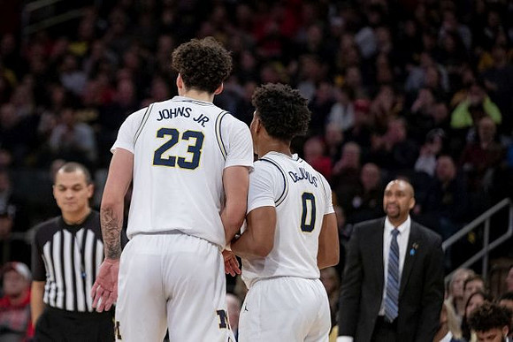 Brandon Johns Jr. (23), David DeJulius (0), and Saddi Washington