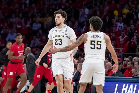 Brandon Johns Jr. (23) and Eli Brooks (55)