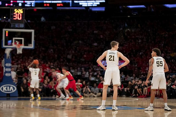 Zavier Simpson (3), Franz Wagner (21), and Eli Brooks (55)