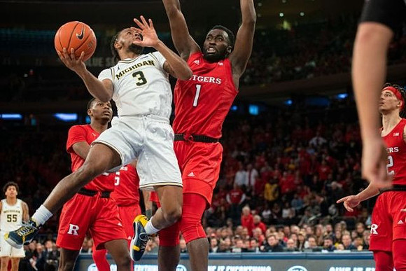 Zavier Simpson (3) and Eli Brooks (55)
