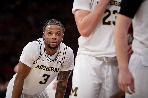 Zavier Simpson (3) and Brandon Johns Jr. (23)