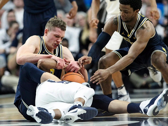 Moritz Wagner (13) and Zavier Simpson (3)