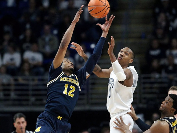 Muhammad-Ali Abdur-Rahkman (12) and Zavier Simpson (3)