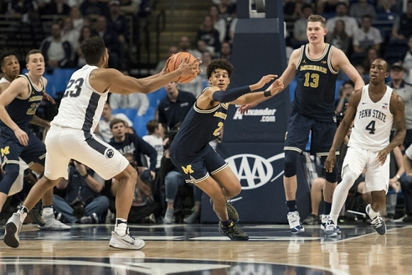 Duncan Robinson (22), Jordan Poole (2), and Moritz Wagner (13)