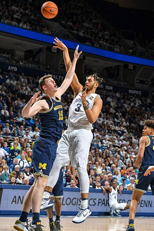 Jon Teske (15) and Jordan Poole (2)