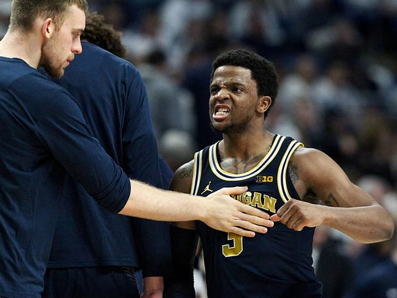 Zavier Simpson (3) and Austin Davis (51)