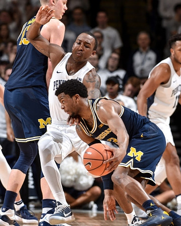 Moritz Wagner (13) and Zavier Simpson (3)