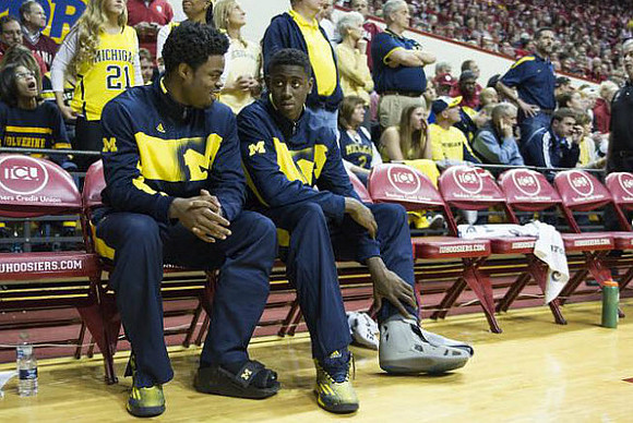 Derrick Walton Jr. (10) and Caris LeVert (23)