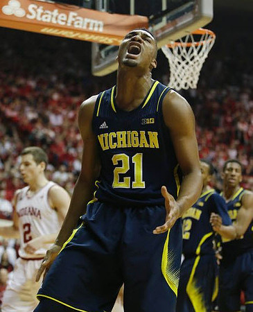 Zak Irvin (21), Muhammad-Ali Abdur-Rahkman (12), and Aubrey Dawkins (24)